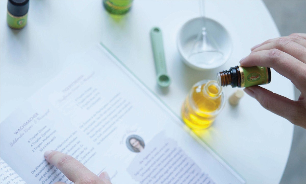 person mixing essential oil
